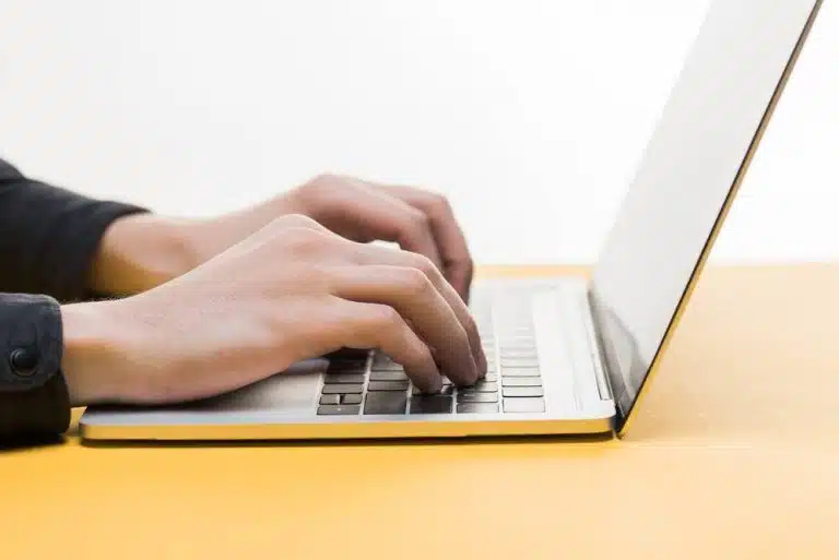 a man pressing a computer