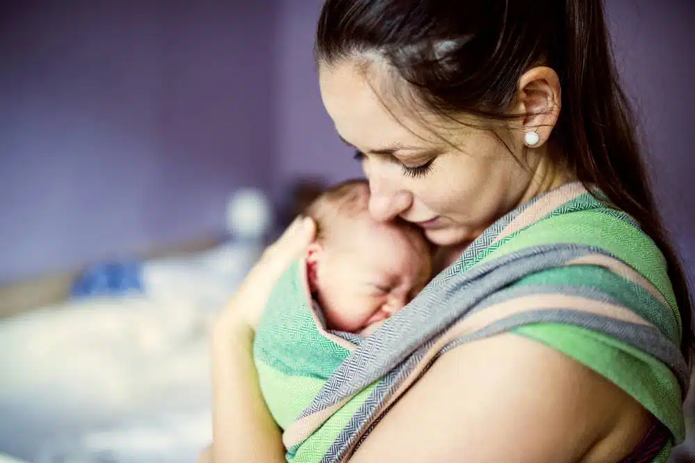 A woman holding a baby