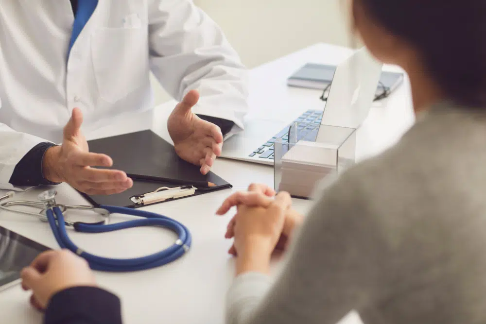 Doctor speaking with patient