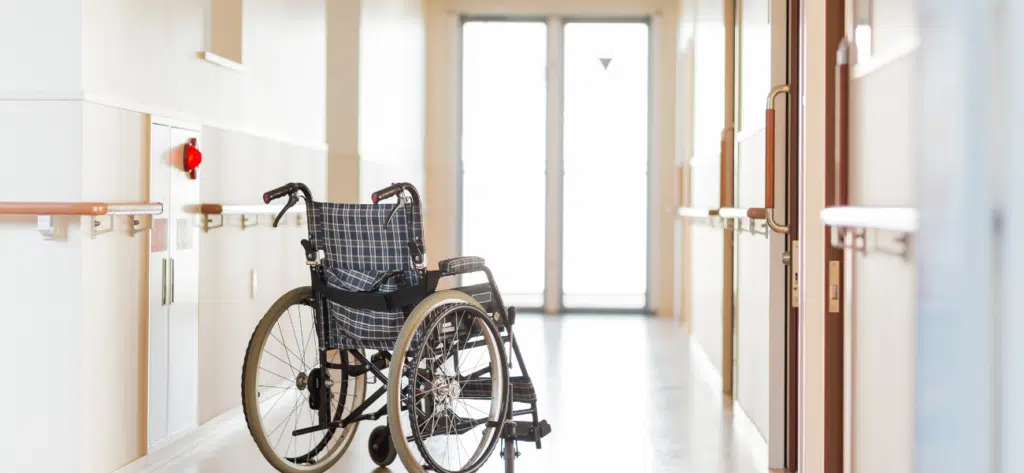 Empty wheelchair in nursing home