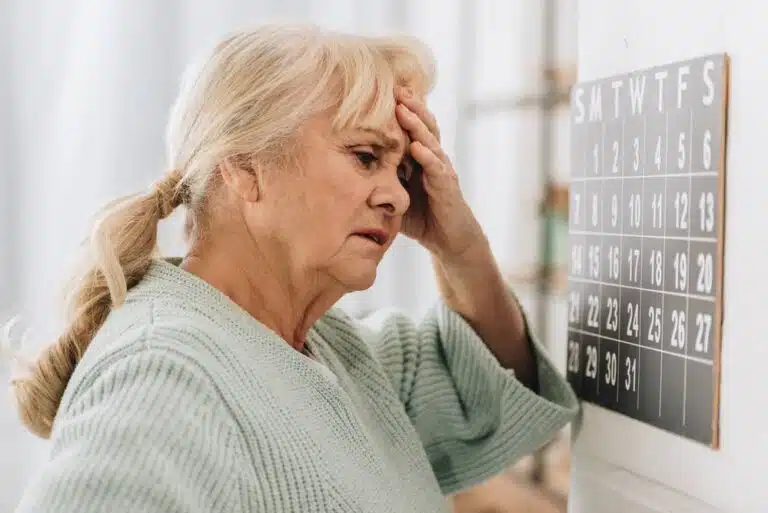 Senior patient feeling headache