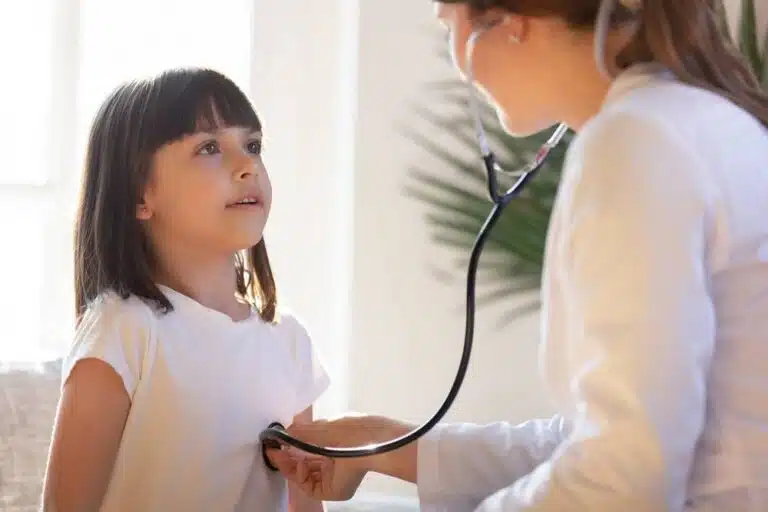 A nurse testing a child