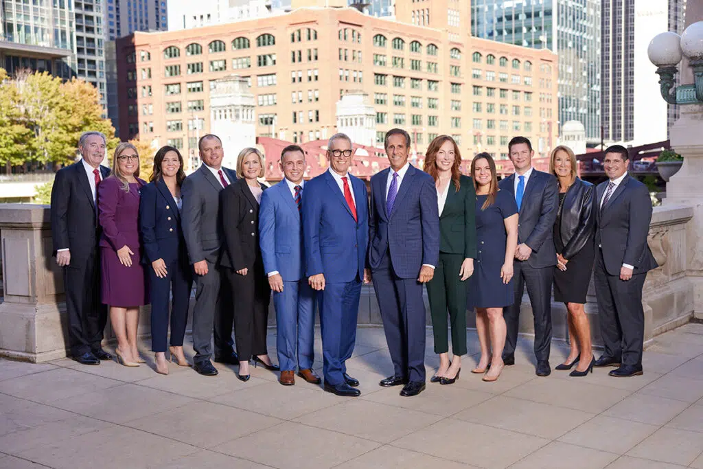 Partners at Levin & Perconti, national medical malpractice attorneys with backdrop of downtown Chicago, IL