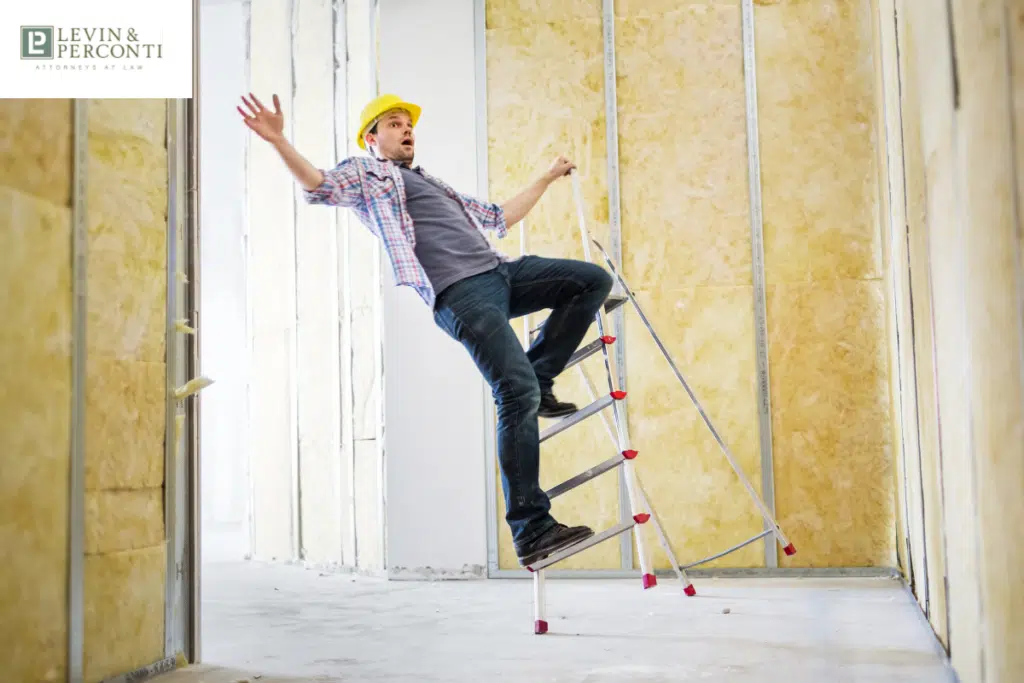 Man falling on ladder at worksite