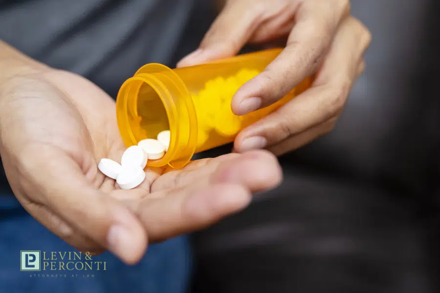 medication being poured into a man's hand