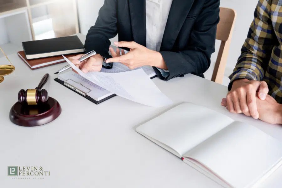 Elder abuse attorney showing paperwork to a client