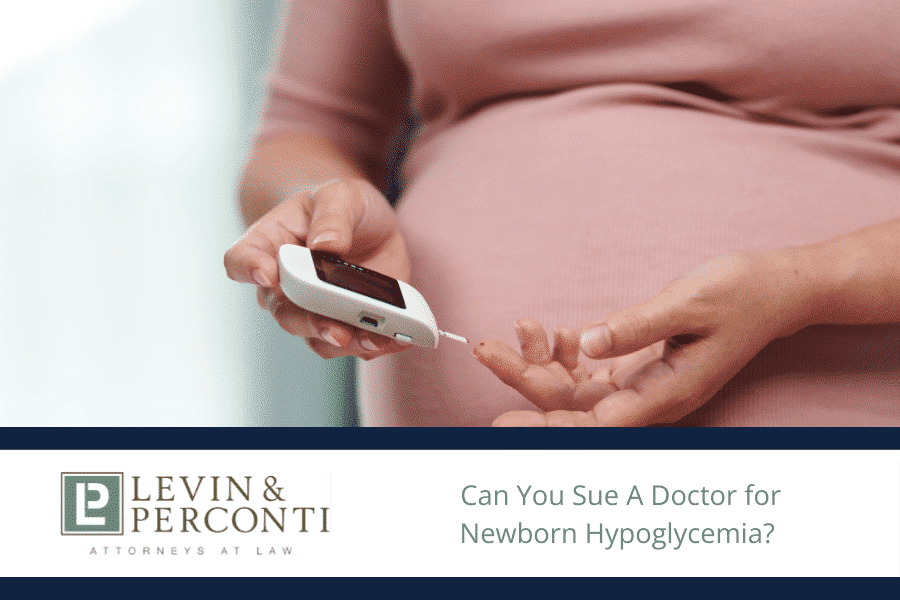 Pregnant woman taking a blood sugar test with a small hand-held device