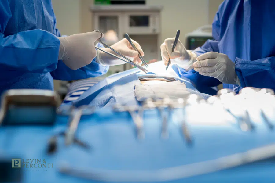 blurred view of surgery being performed on a patient under anesthesia